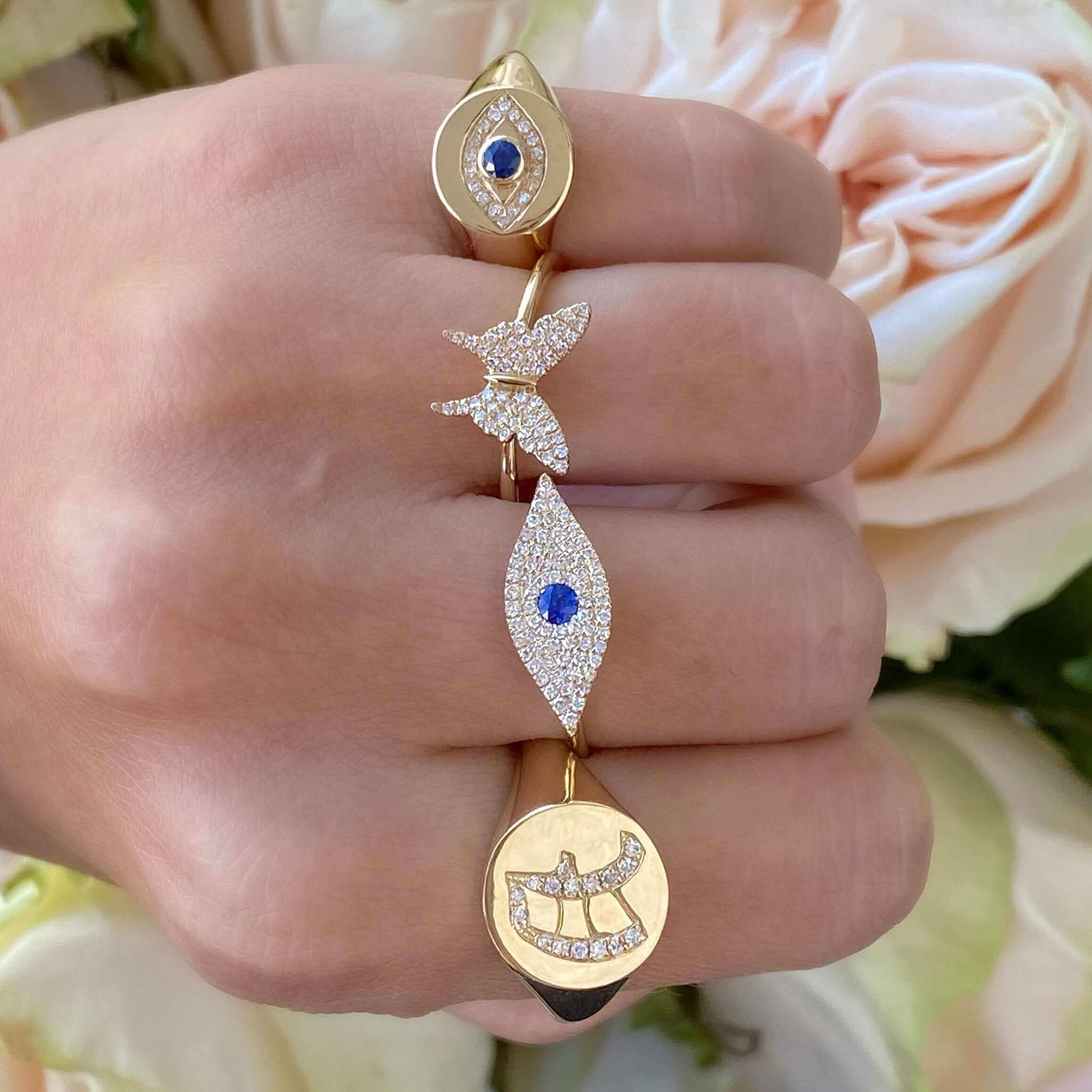 Elegant gold rings with sapphire and diamond accents, featuring unique designs from our exclusive jewelry collection