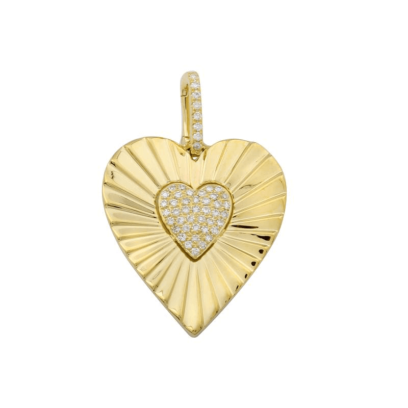 Gold heart-shaped pendant with diamond accents, showcasing intricate design, from our luxury jewelry brand.