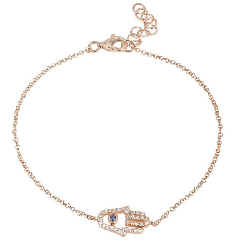 Gold Hamsa hand bracelet with blue gemstone, elegant jewelry piece from our collection, perfect for adding a touch of luxury to any outfit