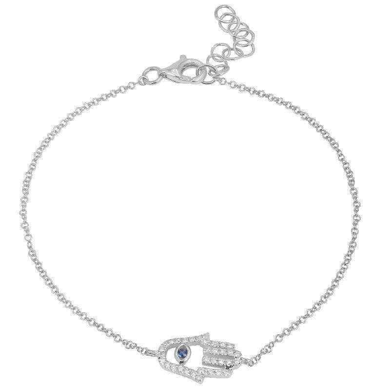 Silver hamsa hand bracelet with blue gemstone, elegant jewelry piece from our collection