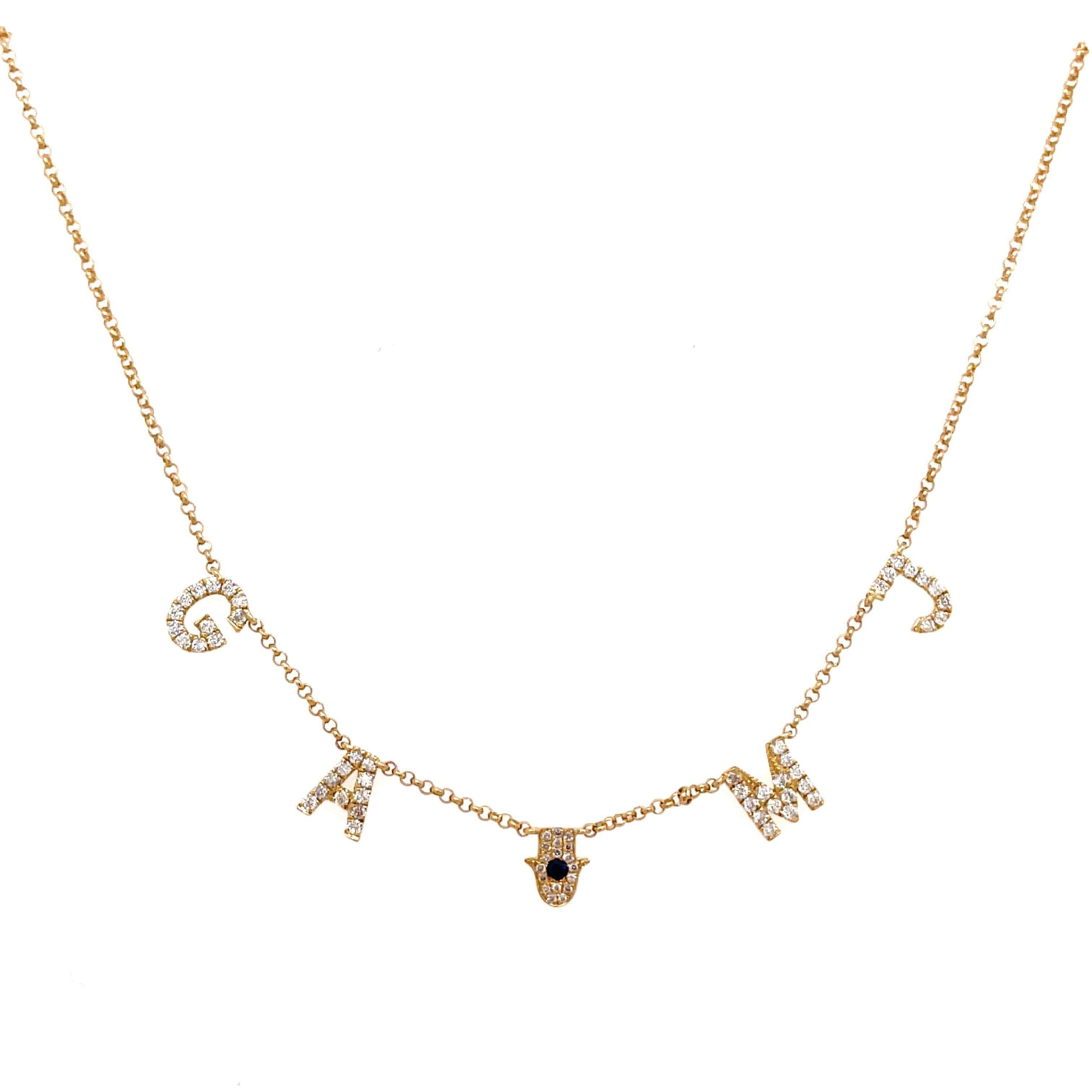 Elegant gold necklace featuring sparkling letter charms and a delicate Hamsa hand charm, perfect for a stylish and personalized jewelry statement.