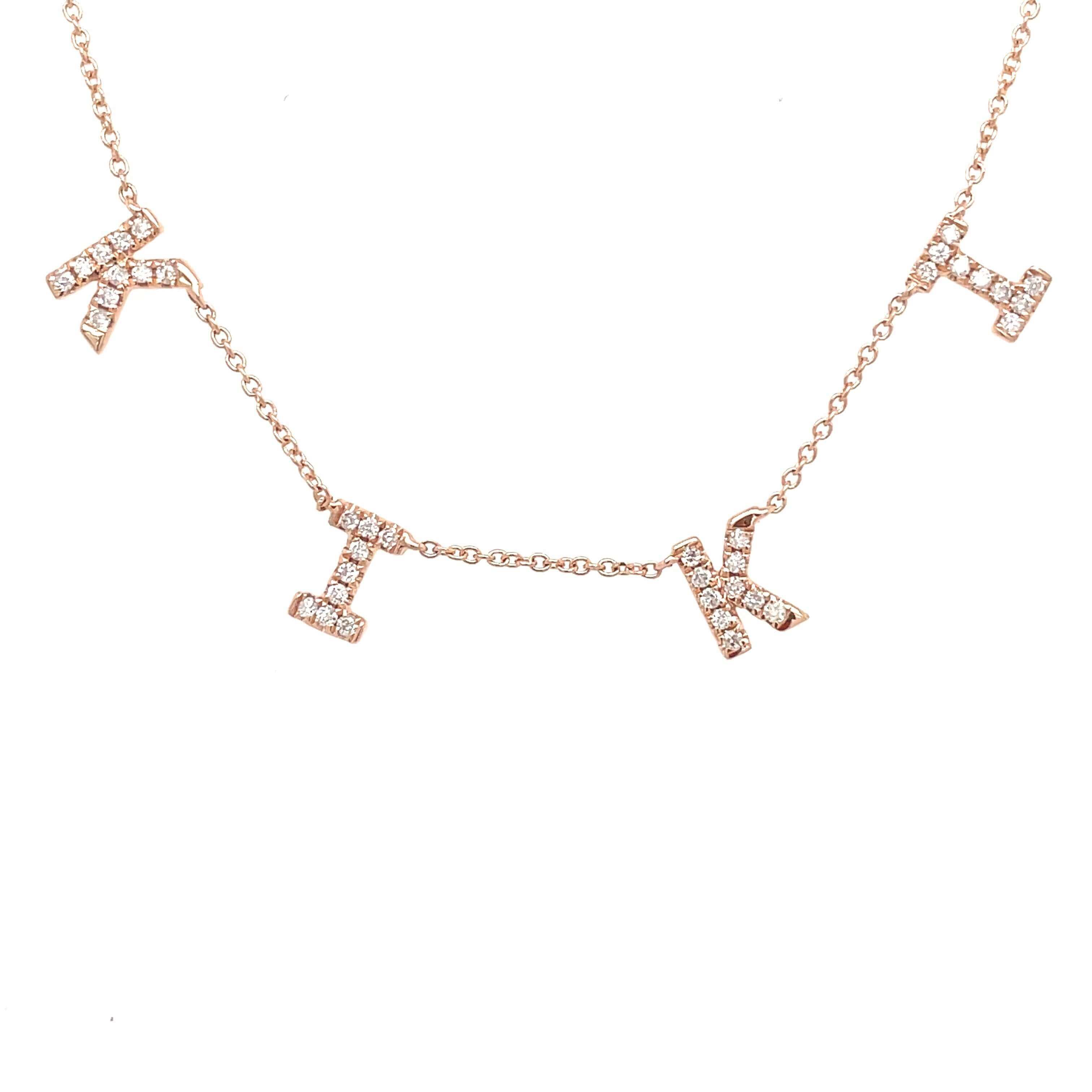 Dainty gold letter pendant necklace with sparkling diamonds from our exclusive jewelry collection.
