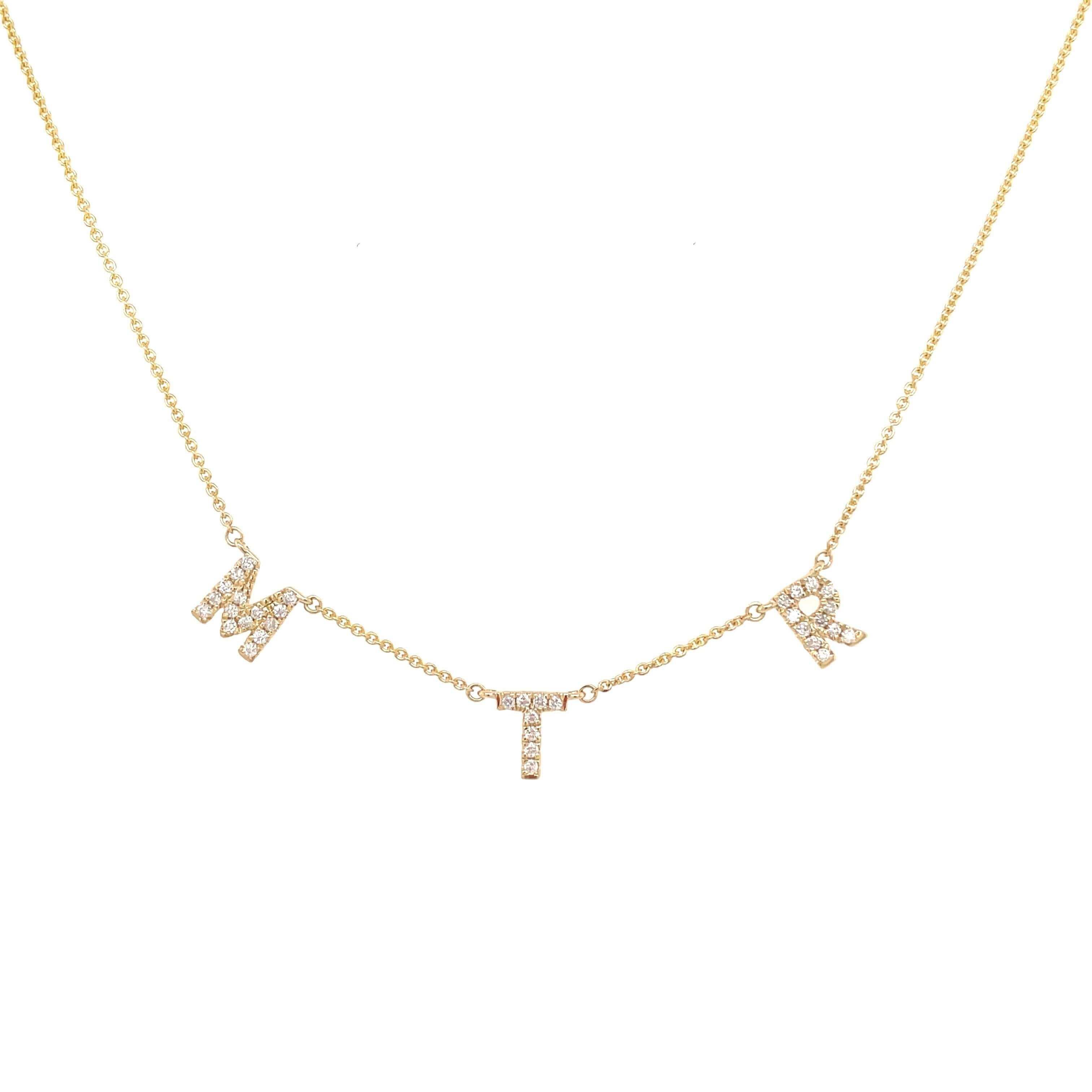 Gold necklace with sparkling "MTK" letter charms from our luxury jewelry collection.