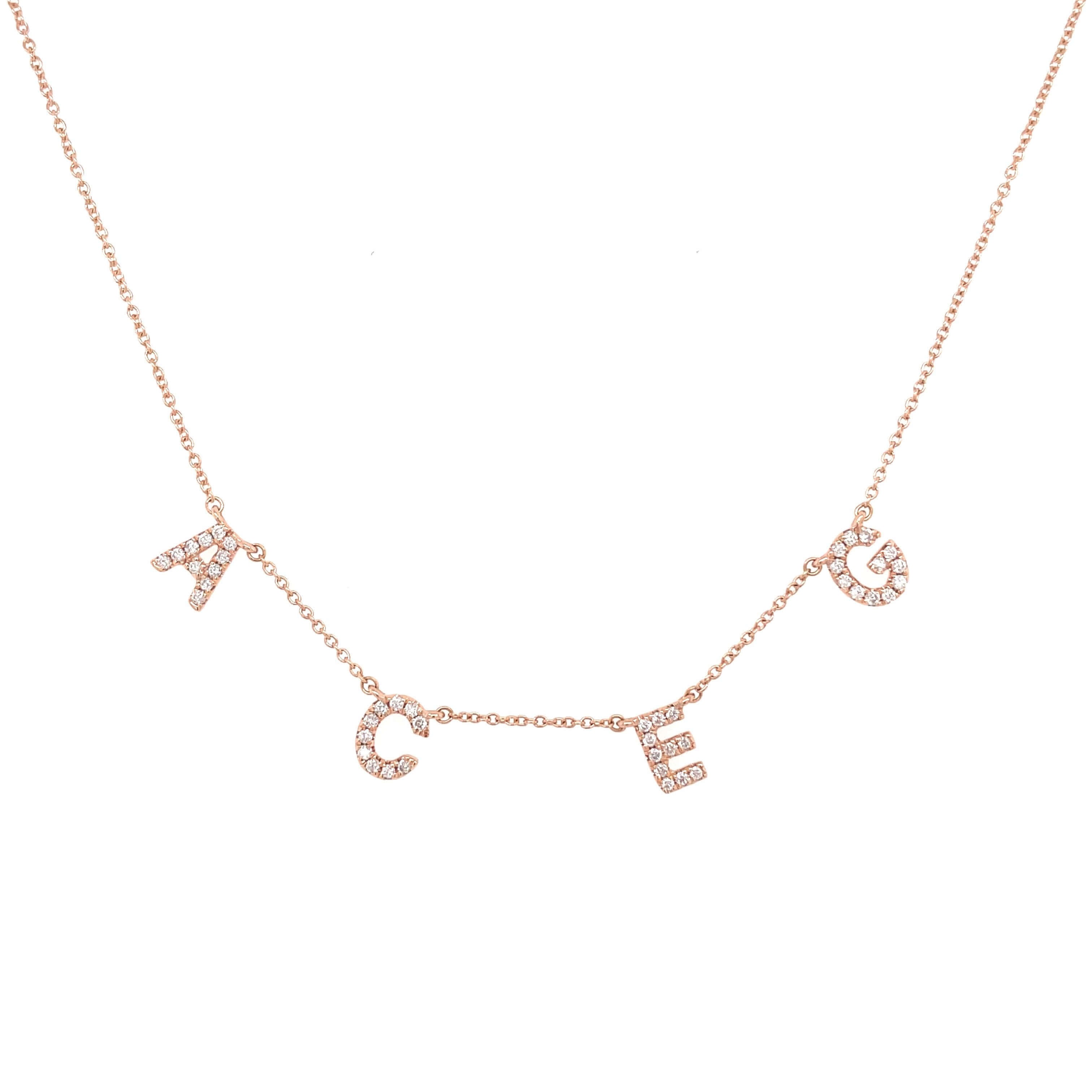 Rose gold necklace with sparkling initial charms by our jewelry brand.