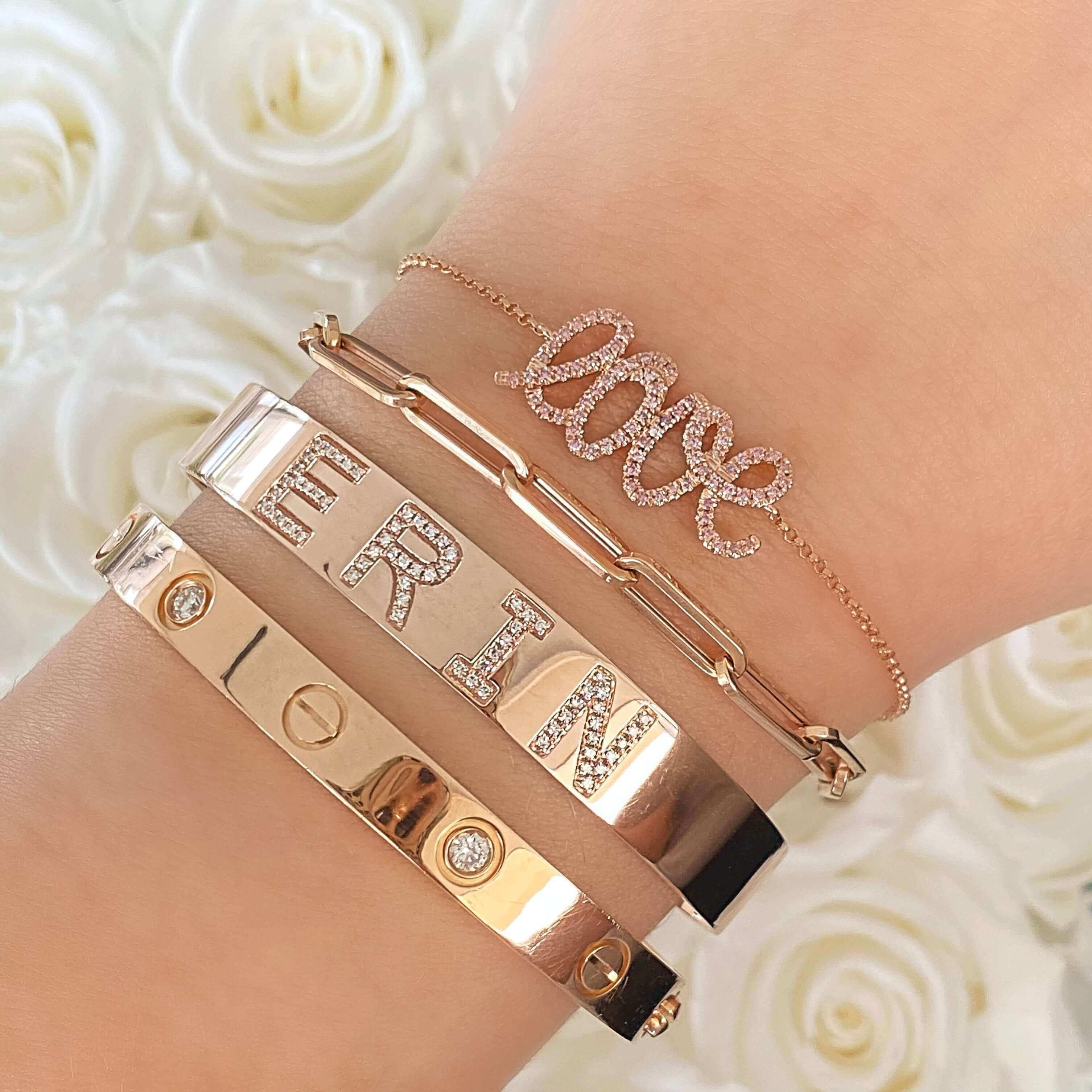 Stylish rose gold and diamond bracelets on wrist with personalized name, perfect for gifting from our luxury jewelry brand.