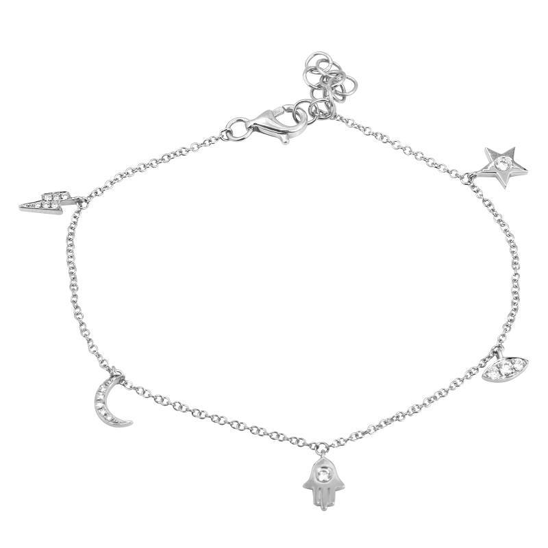 Delicate silver charm bracelet featuring star, moon, and hamsa designs from our exclusive jewelry collection.