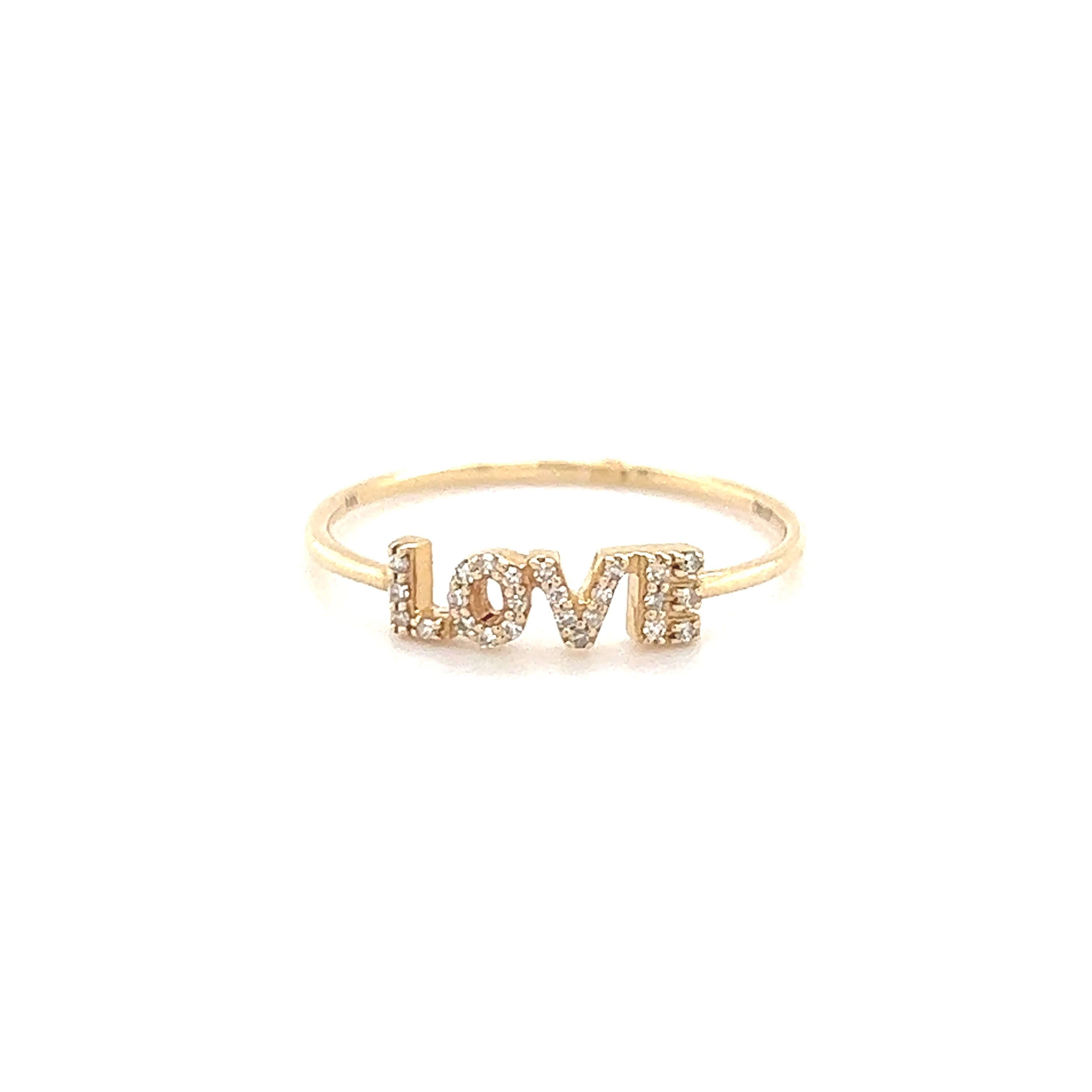 Gold love ring with diamond-studded lettering from our exclusive jewelry collection.