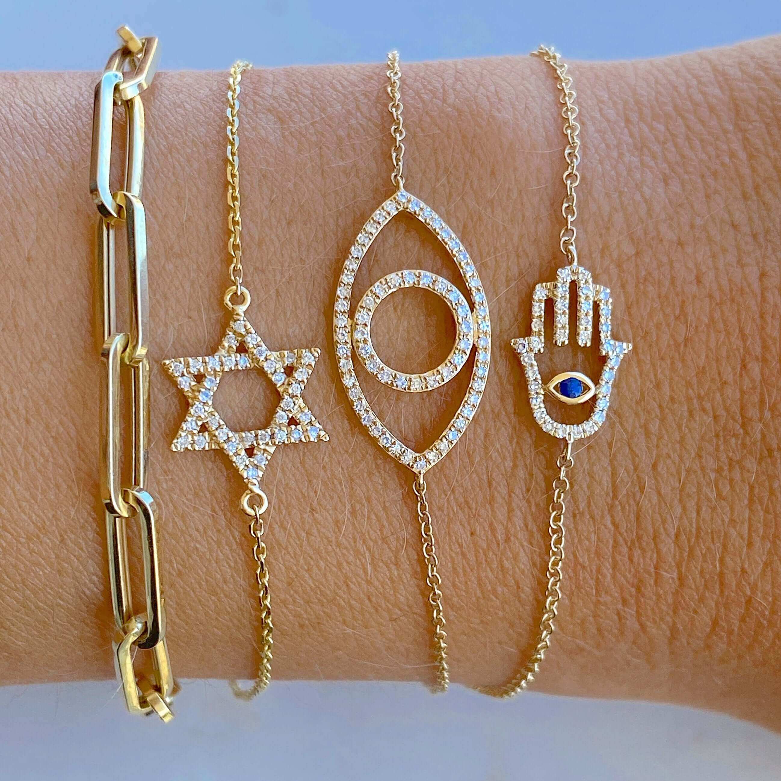 Gold and diamond bracelets featuring symbols, perfect for elegant and stylish jewelry lovers.