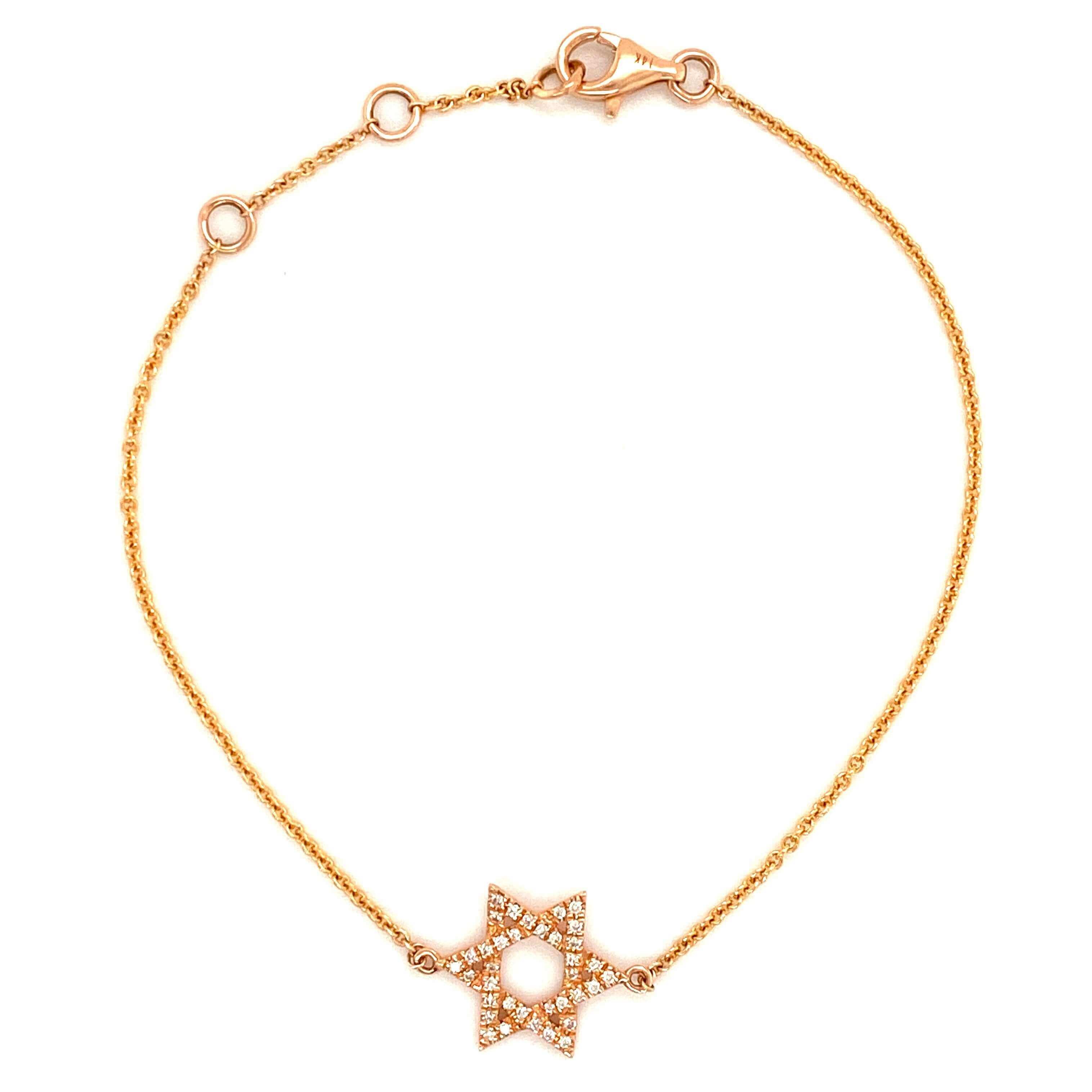 Gold bracelet with a star-shaped pendant featuring pearl and diamond accents from our exclusive jewelry collection.