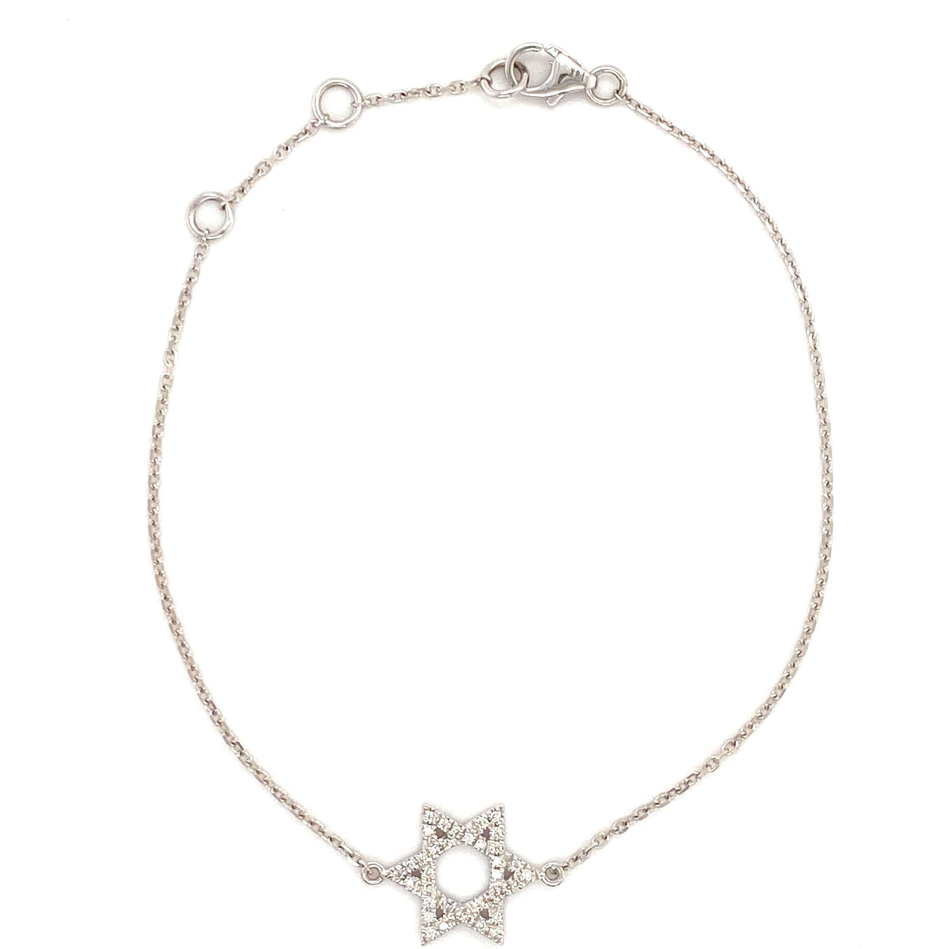 Delicate silver bracelet with star-shaped charm adorned with small diamonds, perfect for adding sparkle to any outfit.