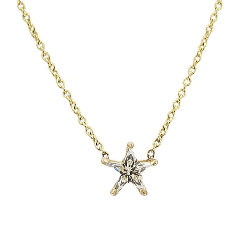 Gold chain necklace with a star-shaped diamond pendant from our jewelry collection.