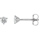 Sparkling diamond stud earrings in a classic four-prong setting, part of our luxury jewelry collection.