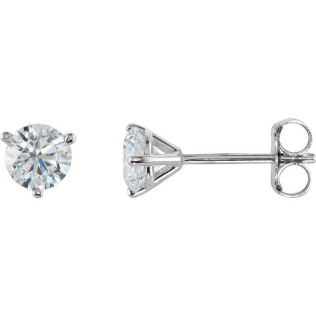 Elegant diamond stud earrings in a classic four-prong setting, perfect for adding a touch of sophistication to any outfit by our jewelry brand.