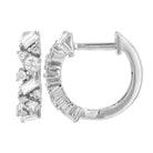 Baguette & Round Diamond Cluster Huggie Earrings featuring diamonds in a cluster design with elegant gold setting.