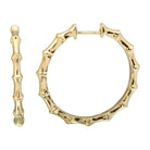 Gold bamboo-style hoop earrings from our exclusive jewelry collection.