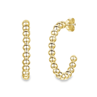 Gold beaded hoop earrings from our luxury jewelry collection.