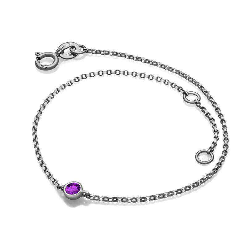 Elegant silver bracelet with purple gemstone, perfect for adding a touch of luxury to any outfit – our fine jewelry collection.