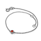 Dainty silver bracelet with a single red stone from our exclusive jewelry collection.