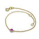 Elegant gold bracelet with purple gemstone by our jewelry brand