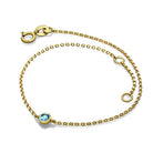 Gold bracelet with blue gemstone accent from our elegant jewelry collection