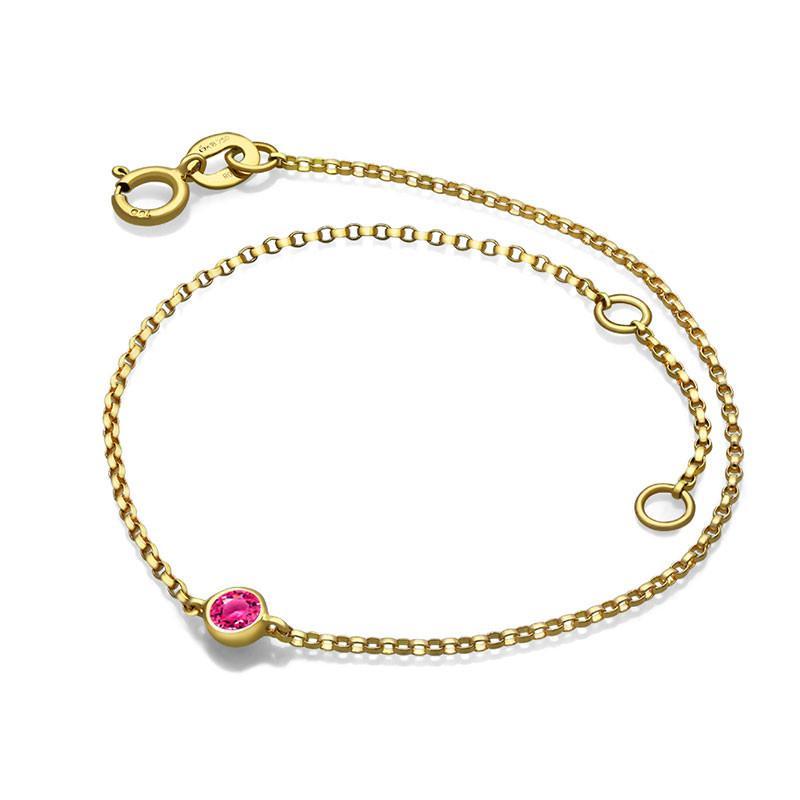 Elegant gold bracelet with a ruby gemstone from our luxury jewelry collection