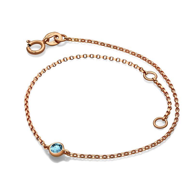 Rose gold bracelet with a blue gemstone by luxury jewelry brand.