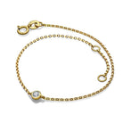 Elegant gold chain bracelet featuring a single diamond from our luxury jewelry collection.