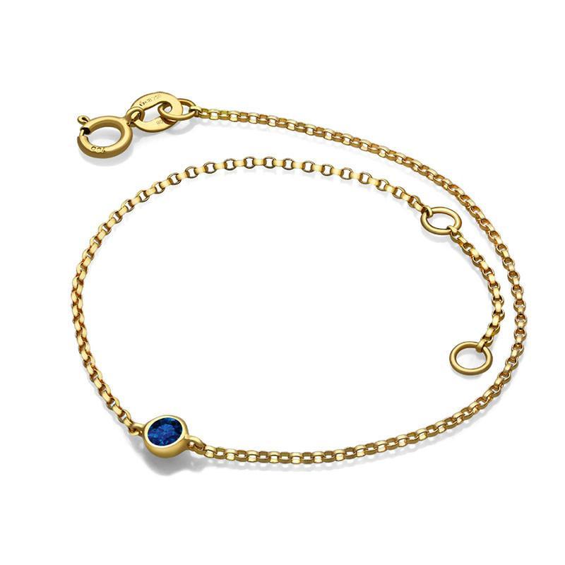 Elegant gold bracelet with blue gemstone from our exclusive jewelry collection