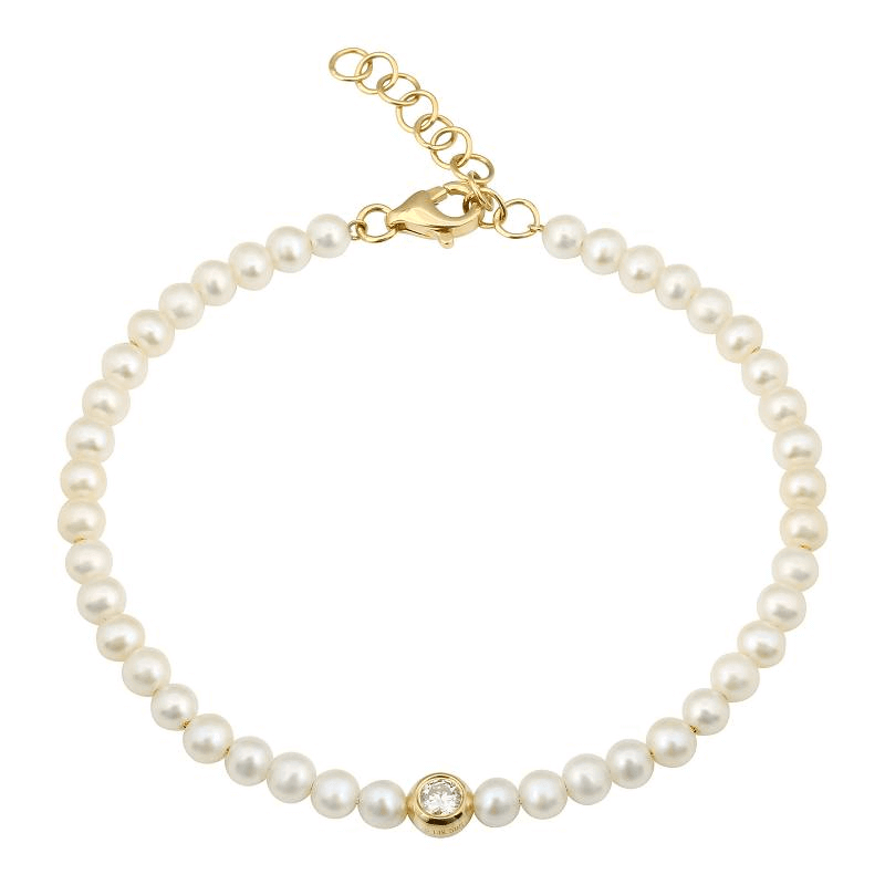 Elegant pearl bracelet with gold clasp and single diamond accent from our luxury jewelry collection.