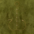 Diamond Bezel Station Hand Chain in 14K yellow gold, styled, Izakov Fine Jewelry