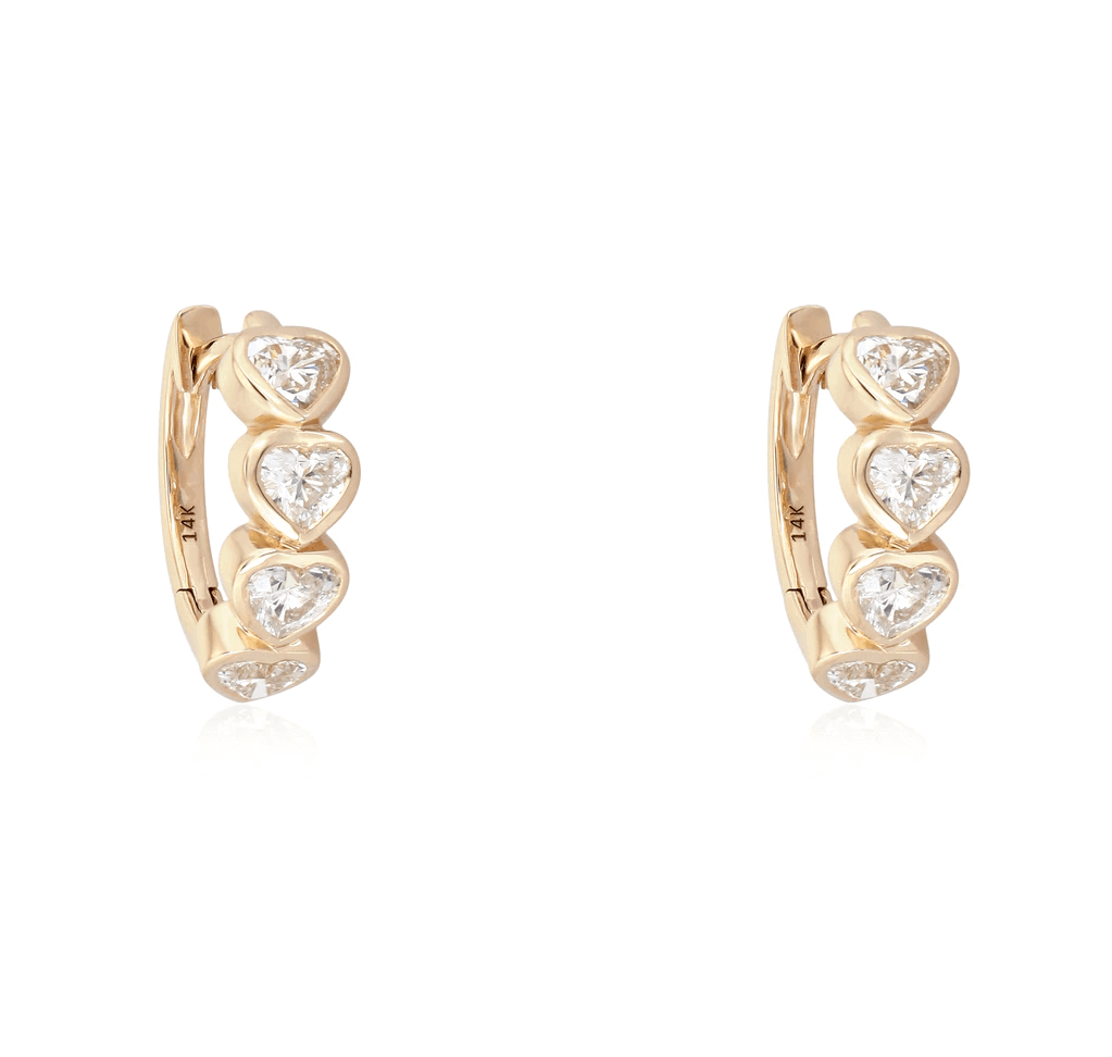 Elegant gold earrings with heart-shaped diamonds from our jewelry collection. Perfect for a sophisticated look.