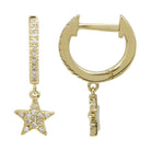 Gold hoop earrings with sparkling star pendant from our luxury jewelry collection.