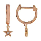 Rose gold hoop earrings with dangling star charm and clear gemstone from our luxury jewelry collection.