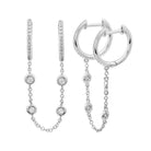 Elegant silver hoop earrings with attached chain and sparkling gemstones from our luxury jewelry collection.