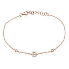 Delicate rose gold bracelet with an initial "B" charm and diamond accents, perfect for personalizing your jewelry collection