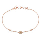 Rose gold bracelet with elegant initial 'E' charm and delicate link chain, perfect for personalized jewelry collections.