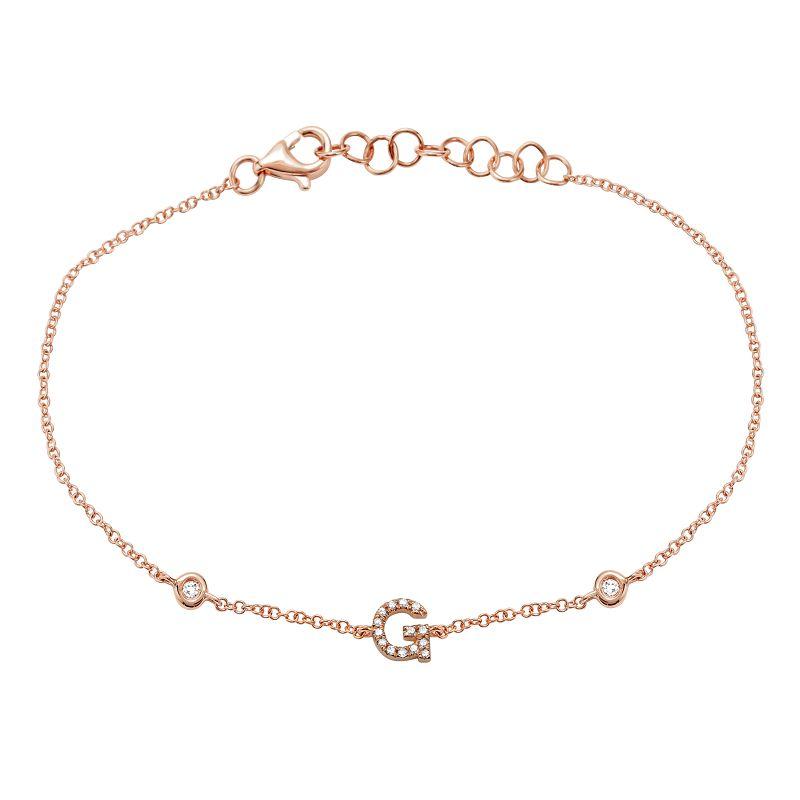 Delicate rose gold bracelet with letter G initial charm and sparkling gemstones.