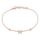 Rose gold bracelet with a diamond-studded "H" charm from our luxury jewelry collection.