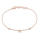 Rose gold bracelet with personalized "K" initial charm adorned with diamonds, from our elegant jewelry collection