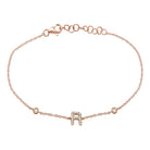 Delicate gold bracelet with sparkling rhinestone 'R' charm from our exclusive jewelry collection