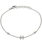 Elegant silver bracelet with letter "H" charm and delicate chain from our luxury jewelry collection.