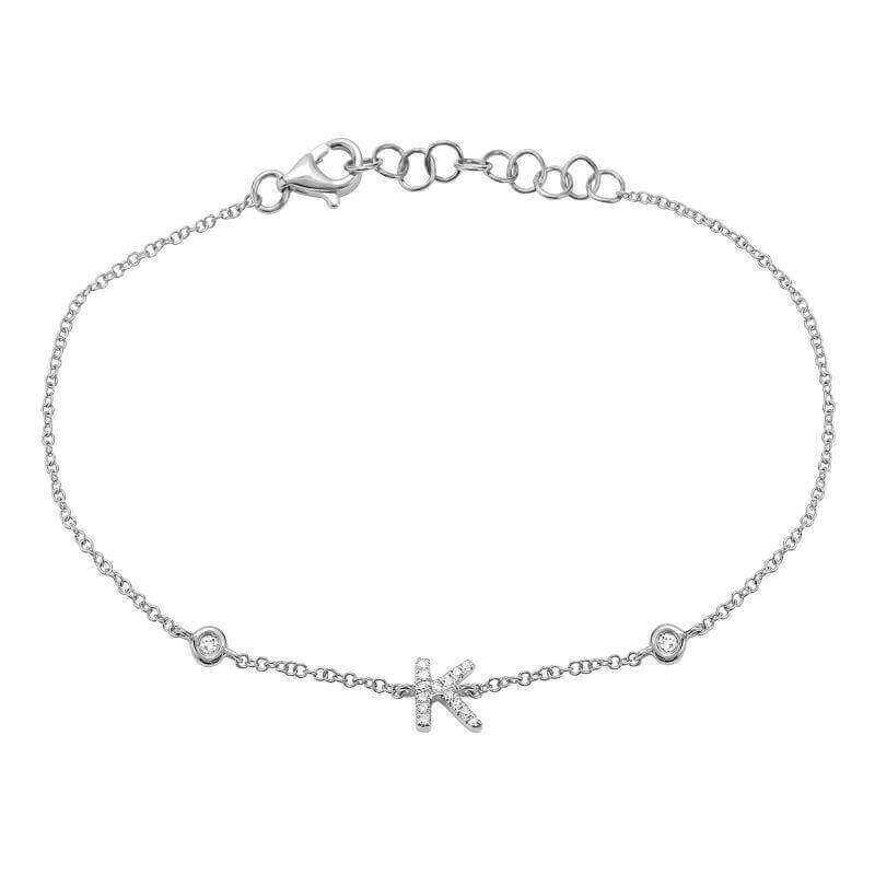 Delicate sterling silver bracelet with initial "K" charm, adorned with small diamonds, perfect for personalized jewelry lovers