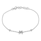 Elegant silver bracelet with a diamond-studded "M" pendant from our luxurious jewelry collection.