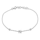 Elegant silver bracelet featuring a delicate chain with a stylish "N" charm, perfect for personalized jewelry lovers.