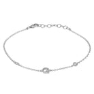 Elegant silver bracelet with delicate chain and sparkling accents, perfect for adding a touch of sophistication to any outfit.