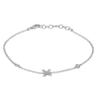 Elegant silver chain bracelet with star and circle charms from our luxury jewelry collection.