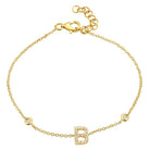 Gold bracelet with B initial charm and diamond accents by our jewelry brand