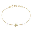 Gold bracelet with diamond-studded initial "F" charm by our premium jewelry brand