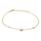 Delicate gold bracelet with star charm and diamond accents by our jewelry brand