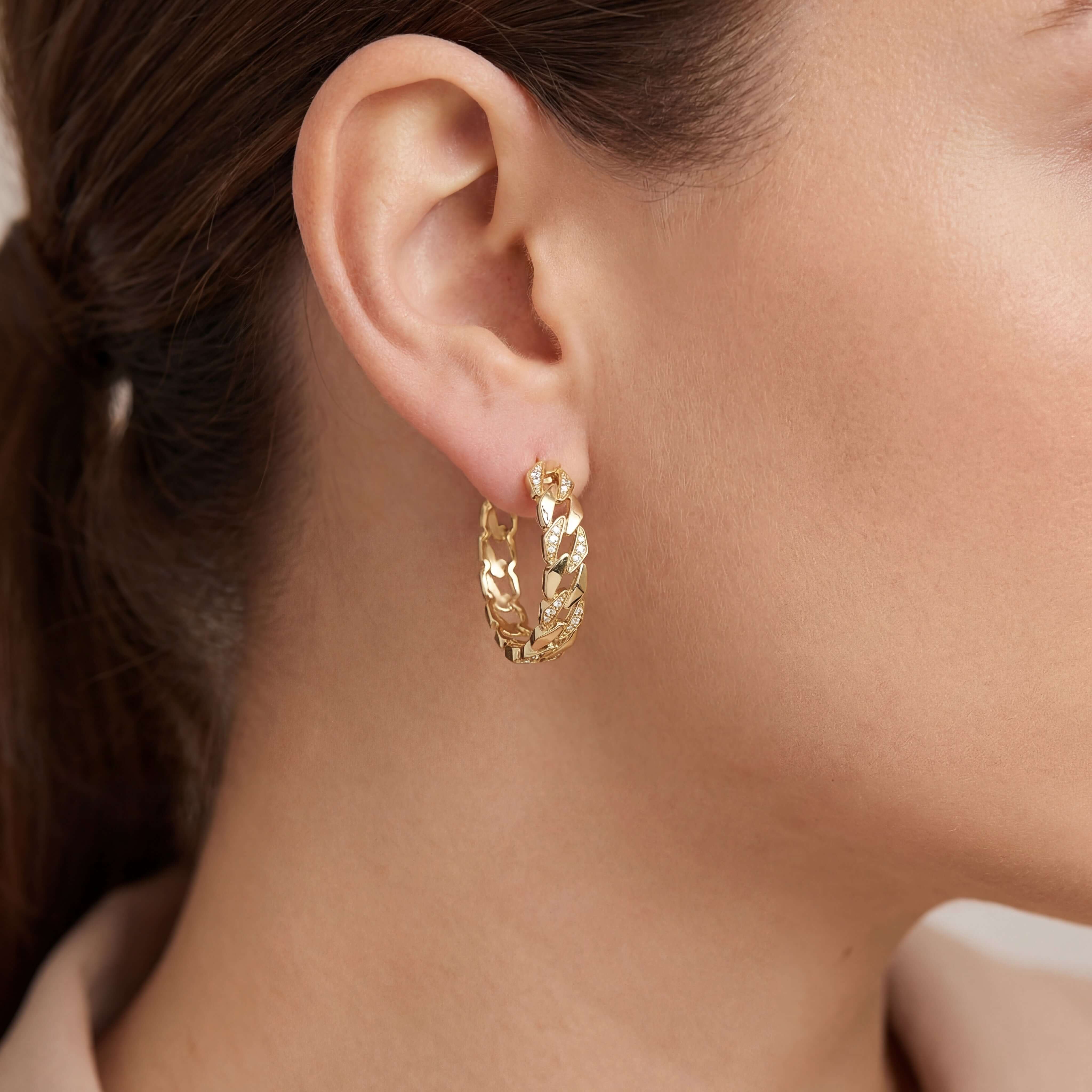 Diamond Cuban Link Hoop Earrings in 14k gold worn by a model, showcasing elegance and sparkle.